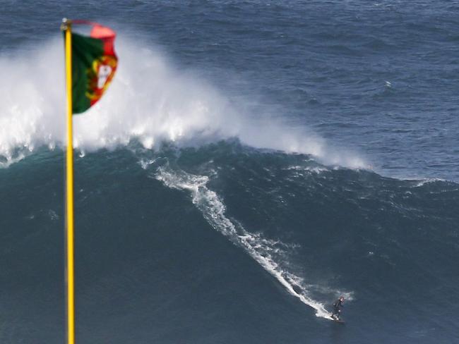 The massive waves are known to reach 80ft (24m) in height. Picture: EPA/PAULO CUNHA