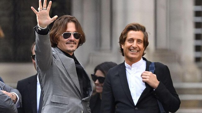 David Sherborne with Johnny Depp on the steps of the High Court in London. Picture: Getty Images.