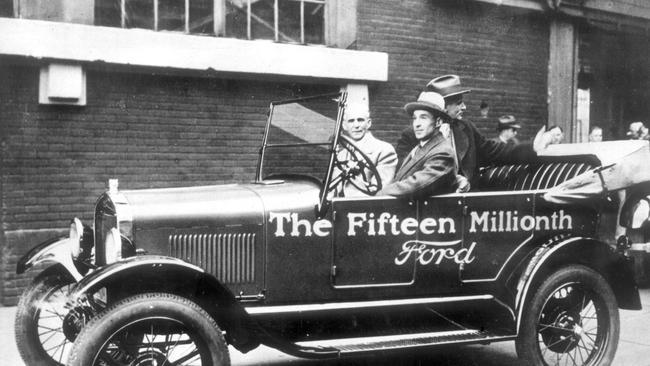 Henry Ford (light suit) in a T-model, the 15 millionth Ford, in about 1927.