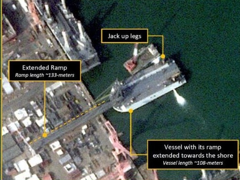 New satellite photos have revealed the construction of a new fleet of D-Day-style landing barges needed to surge troops and tanks over a beach. Picture: @AllSourceA/X