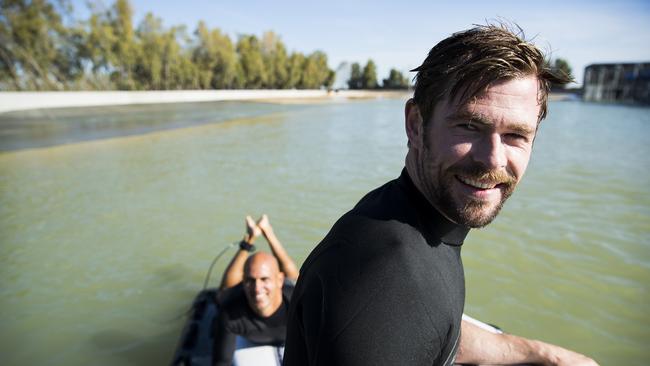 Chris Hemsworth loves testing different surfing spots. Pictured here with Kelly Slater and at a Californian surf ranch.