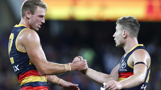 Adelaide defenders Daniel Talia and Rory Laird celebrate a win last season. Picture: Sarah Reed