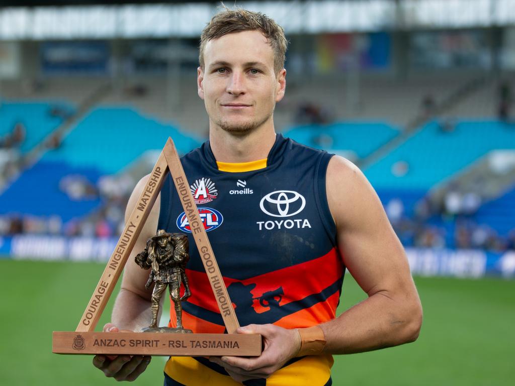 Jordan Dawson with the Spirit of Anzac trophy. Picture: Linda Higginson/AFL Photos via Getty Images