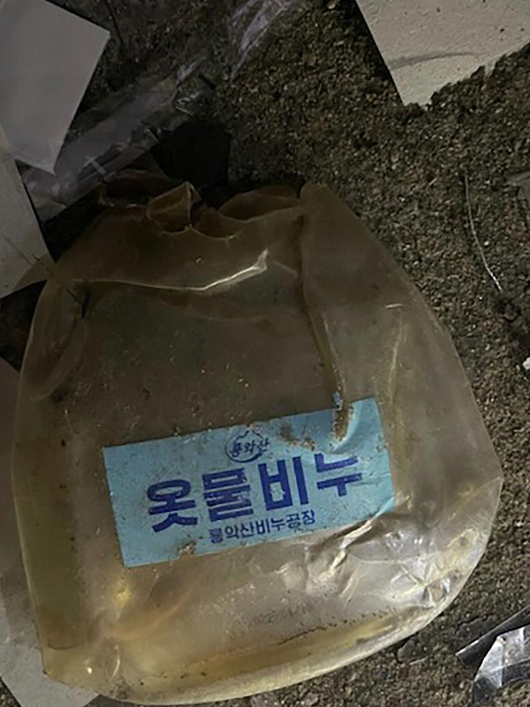 There was random trash in the nag. (Photo by Handout / South Korean Defence Ministry / AFP)