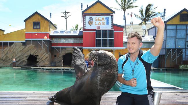 Oscar the Australian Sealion with senior trainer Deane Jones at Sea World. Picture: Glenn Hampson