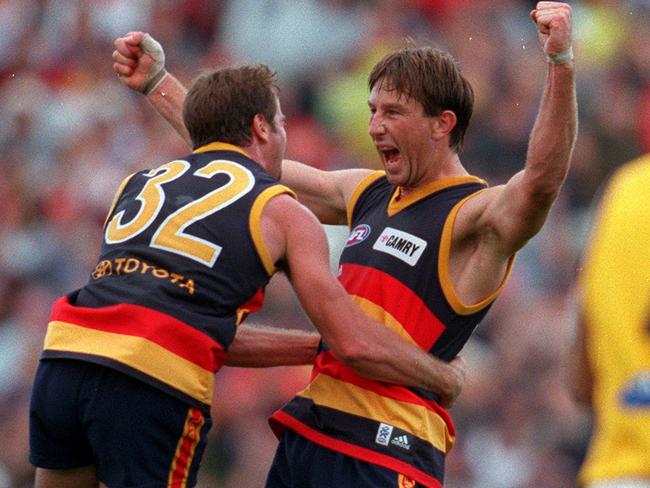 Adelaide legends Mark Ricciuto and Shaun Rehn in the Crows’ 2000 traditional jumper. Picture: Ray Titus