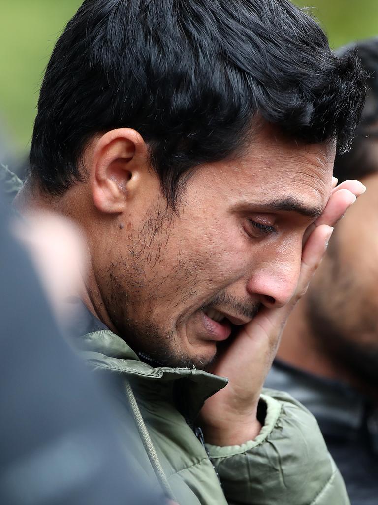 Friends and family of the victims wait near the hospital. Picture: Fiona Goodall