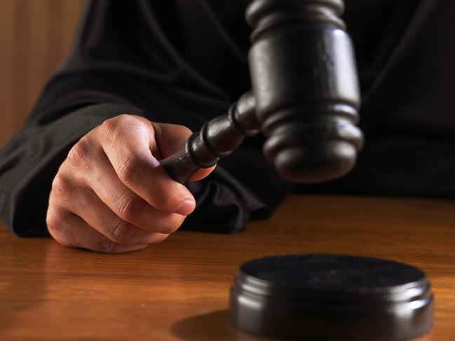 Generic image of a judge hitting a gavel. In a courtroom . Credit : Thinkstock