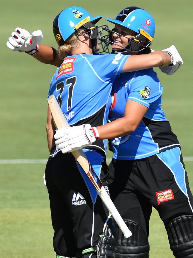 Strikers big-hitters Sophie Devine and Suzie Bates celebrate after winning their WBBL match against the Hobart Hurricanes at Karen Rolton Oval on January 8, 2019. Picture: AAP Image/David Mariuz