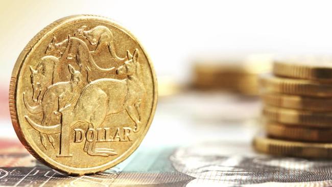 Aussie one dollar coins, on a twenty dollar note.