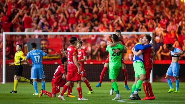 Adelaide players celebrate on the final whistle after the FFA Cup at Coopers Stadium