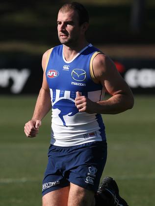 Ben Cunnington runs laps at North Melbourne training this week. Picture: Wayne Ludbey