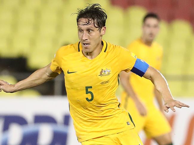 MALACCA, MALAYSIA - OCTOBER 05: Mark Milligan of Australia runs with the ball during the 2018 FIFA World Cup Asian Playoff match between Syria and the Australia Socceroos at Hang Jebat Stadium on October 5, 2017 in Malacca, Malaysia.  (Photo by Robert Cianflone/Getty Images)