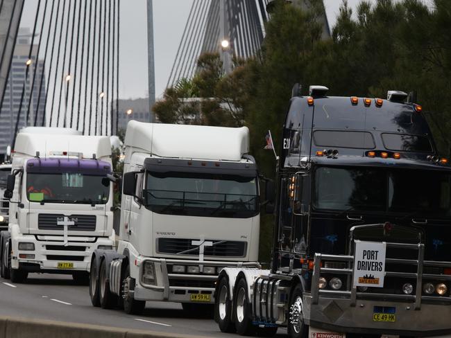 Major truck convoy through the streets of Sydney and over the harbour and Anzac bridges.The convoy goes over the Anzac Bridge