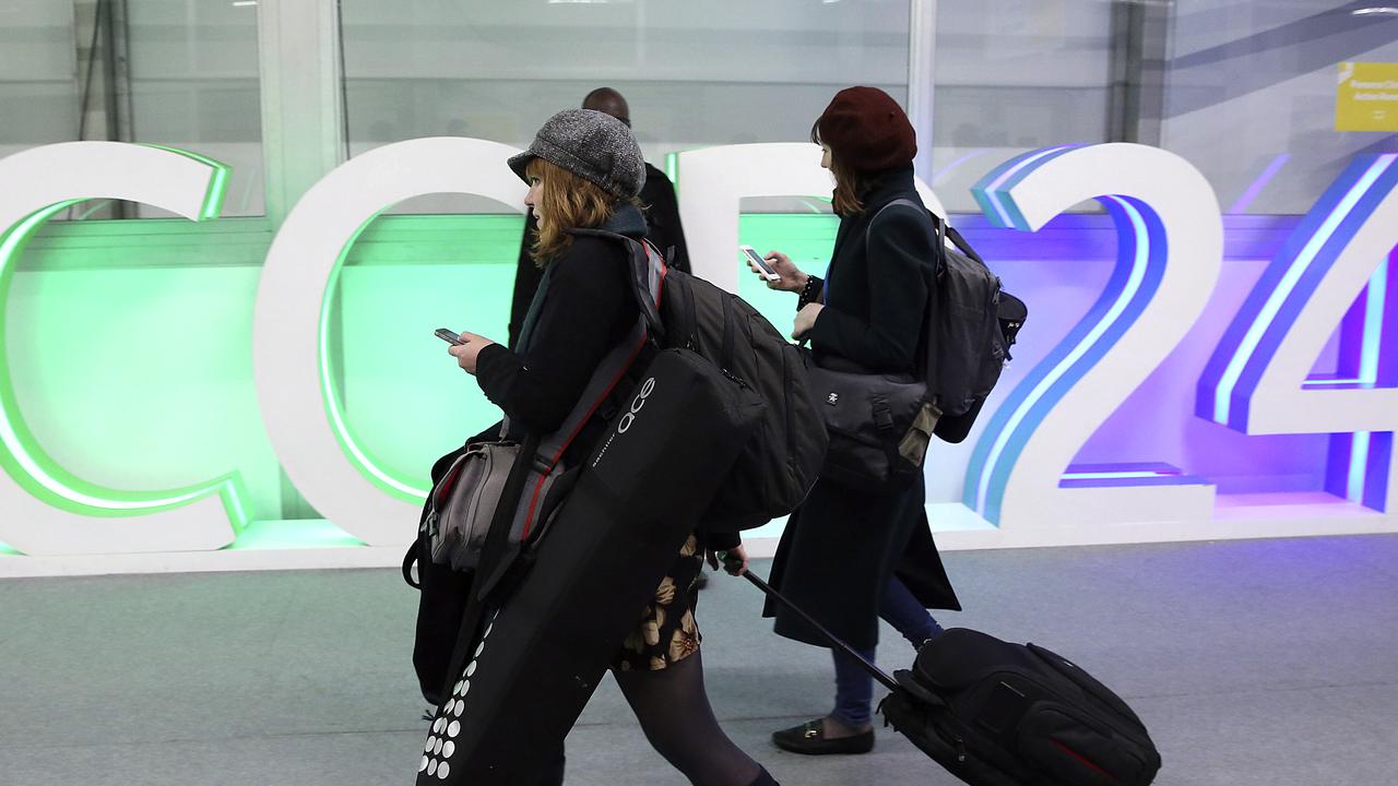 A participants leaves before the end of the final session of the COP24 summit on climate change. Picture: AP 