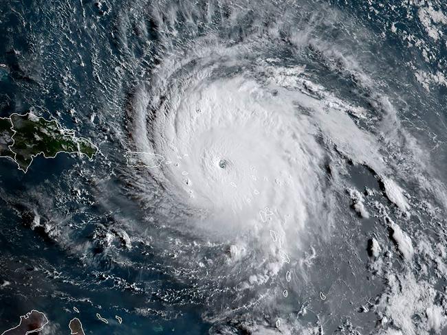 Irma from space on Wednesday as it smashes the Caribbean islands of St Barts and St Martin with winds of more than 300km/h. Picture: AFP PHOTO / NOAA