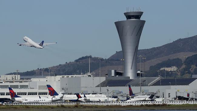 The control tower at San Francisco International Airport, where an Air Canada jet came within metres of landing on a packed taxiway. Picture: AP