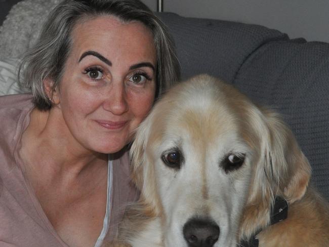 Candace Feild with her golden retriever Sammy.