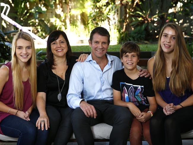 Mike Baird with his family at home in Fairlight. Picture: Bradley Hunter