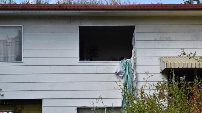 A police spokeswoman said the window panes were removed so authorities could access the bodies inside the house. Picture: Jessica Baker