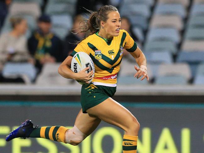 Isabelle Kelly of the Jillaroos races over to score a try  during the Australian Jillaroos v NZ Kiwi Ferns match at GIO Stadium, Canberra. pic Mark Evans