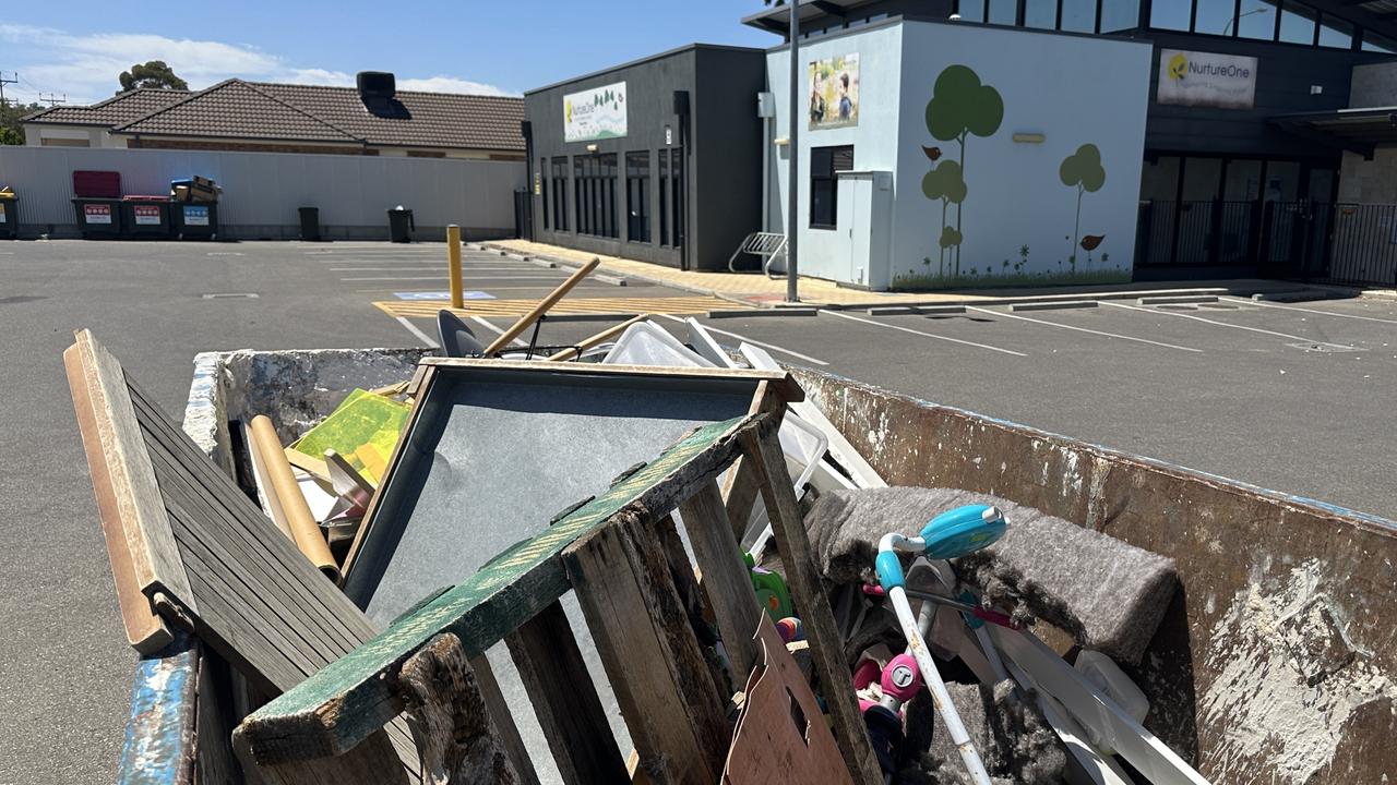 A bin full of chairs, toys and other discarded items out the front of the Genius Childcare centre in Blair Athol. Picture: Sam Lowe