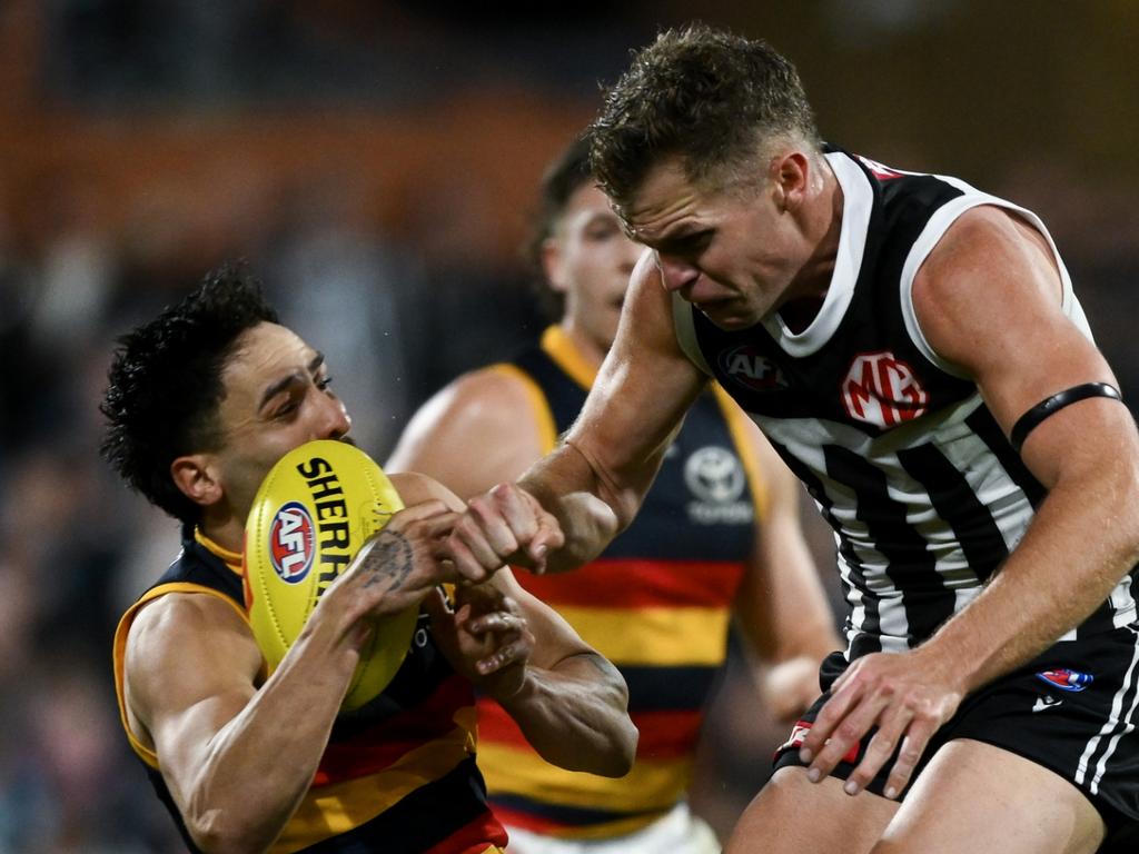 ADELAIDE, AUSTRALIA – AUGUST 17: Izak Rankine of the Crows is knocked out by a late hit from Dan Houston of the Power during the round 23 AFL match between Port Adelaide Power and Adelaide Crows at Adelaide Oval, on August 17, 2024, in Adelaide, Australia. (Photo by Mark Brake/Getty Images)