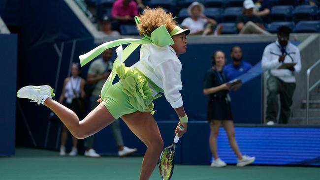 Japan's Naomi Osaka warms up before her women's singles first round match against Latvia's Jelena Ostapenko on day two of the US Open tennis tournament at the USTA Billie Jean King National Tennis Center in New York City, on August 27, 2024. (Photo by TIMOTHY A. CLARY / AFP)