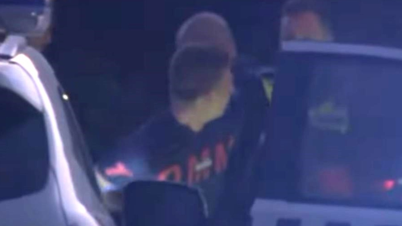 Scott Quilliam was arrested in Hamlyn Heights after breaking into a second property after using a stolen car to ram the garage doors of several homes. Picture: Channel 7.