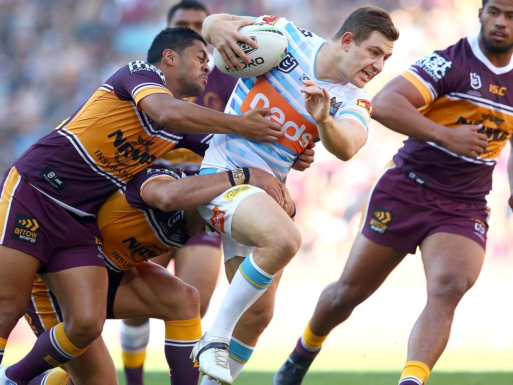 BRISBANE, AUSTRALIA - JUNE 09: Ryley Jacks of the Titans tries to break free during the round 13 NRL match between the Brisbane Broncos and the Gold Coast Titans at Suncorp Stadium on June 09, 2019 in Brisbane, Australia. (Photo by Jono Searle/Getty Images)