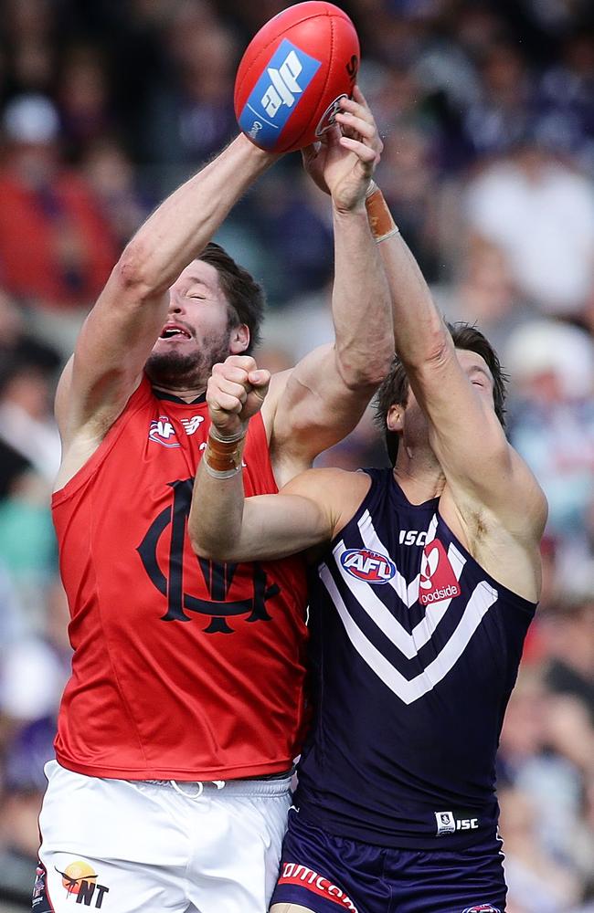 Jesse Hogan grabs the ball in a marking conest with Docker Lee Spurr. Picture: Will Russell (Getty Images)