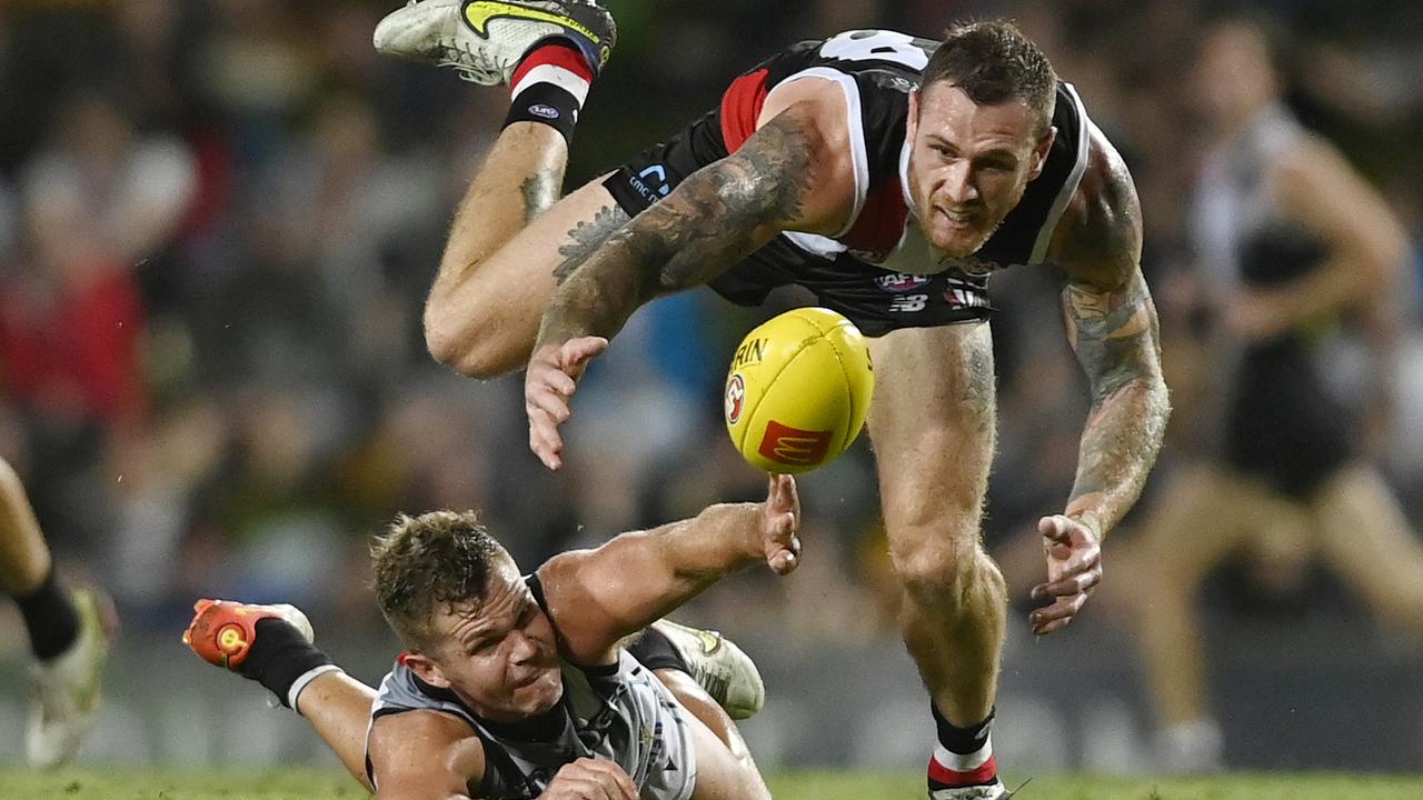 Saint Tim Membrey attacks the ball as Port Adelaide’s Dan Houston slips over Picture: Ian Hitchcock/Getty Images