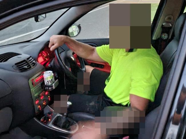 The alleged offender sits in an Alfa Romeo, posing for photos moments after attempting to steal manâs truck at a Kybong service station.