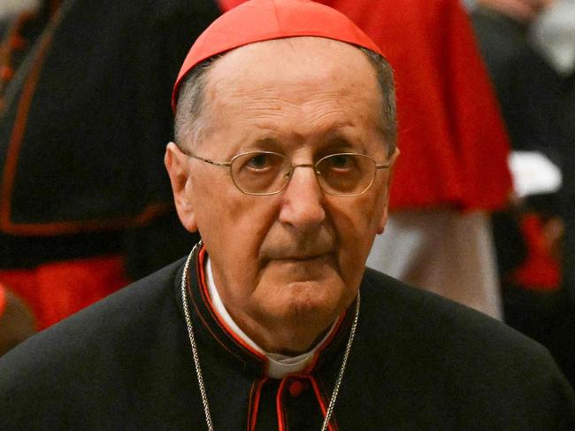 Italian Cardinal Beniamino Stella (C) arrives for a celebration of the Second Vespers at the Santa Maria Maggiore Basilica, which hosts the tomb of late Pope Francis, on the first day of its opening to the public after the Pope's funeral, in Rome on April 27, 2025. (Photo by Alberto PIZZOLI / AFP)