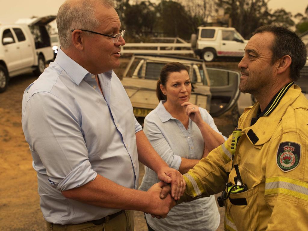 Prime Minister Scott Morrison and wife Jenny with Cobargo RFS captain Mark Ayliffe. Picture: Sean Davey