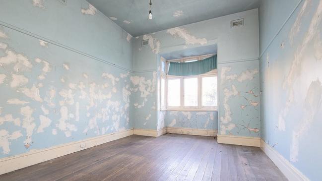 Peeling wall paint in the St Kilda East house.