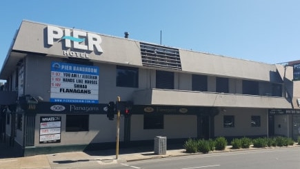 A Frankston off-duty policeman was knocked unconscious in an attack outside Flanagan's Bar in Frankston.