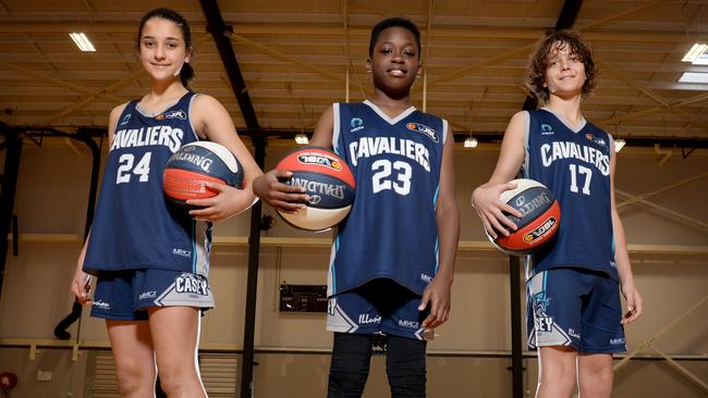 Casey Cavaliers under 12 Mofeoluwa Adio (centre) with under 14 team members Emily Groat and Riley Johnston. Picture: Andrew Henshaw