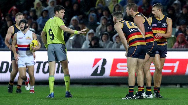 Crows players remonstrate with the umpire in the  match between the Adelaide Crows and the Western Bulldogs at the Adelaide Oval. Pictrure: Kelly Barnes/AAP