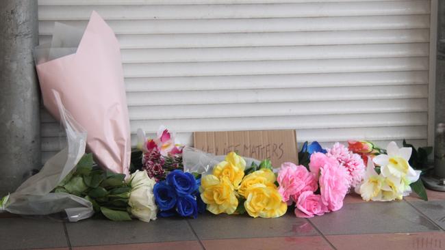 A memorial outside of Alice Springs Coles. NT Police are investigating the death of a 24-year-old man inside the supermarket, which occured while in police custody on May 27, 2025. Picture: Gera Kazakov