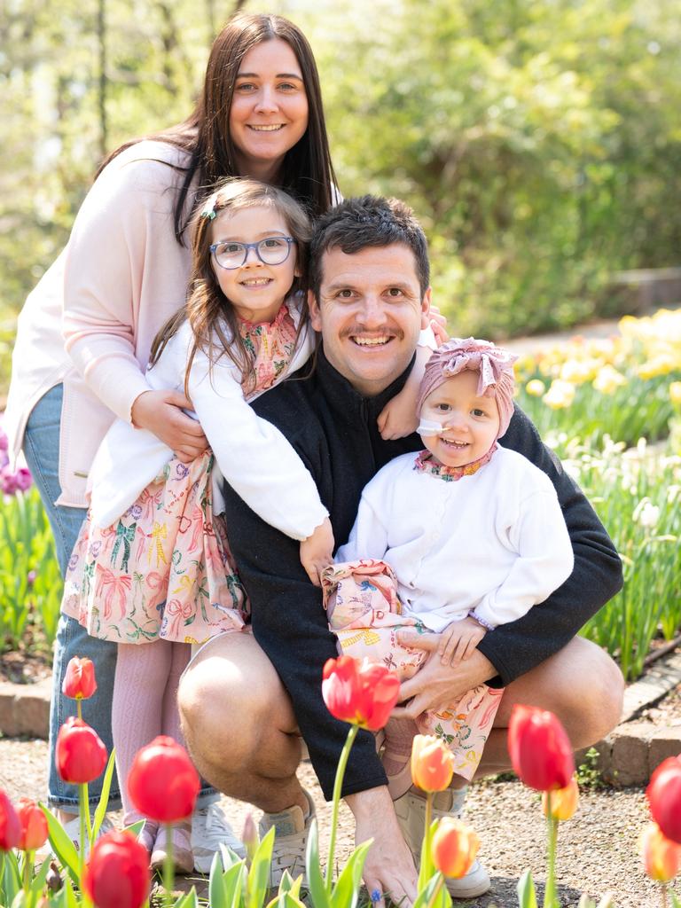 Hailey Valle, who has been given only a few weeks left to live after a leukaemia diagnosis, with her dad Peter, mum Nicole and sister Hannah. Picture: Supplied by family,