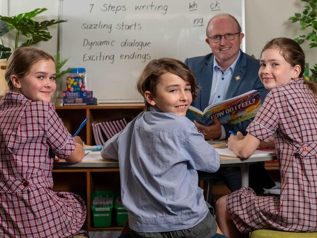 December 8, 2023: Pilgrim School year 5 students (L-R) Lana, Josiah and Ella (School requested no surnames to be used) with school principal Andrew Edmondson.Pilgrim School was ranked 56 for their Year 5 NAPLAN average last year and in 2023 they're now ranked 27. Their results have improved significantly. Picture: Naomi Jellicoe