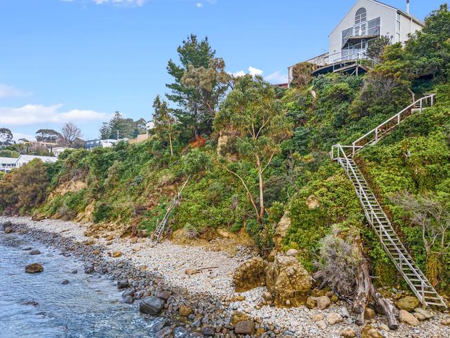 This Sandy Bay waterfront home set an auction record for a single Hobart home at $2.5 million.