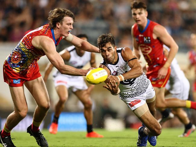 Former Suns player Jack Martin handballs during his standout 21-possession game.