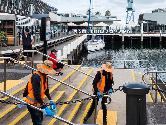 A cleansing team dispatched throughout Victoria as part of an initiative funded by the state government to re-employ those unemployed during COVID-19. Picture: Getty Images