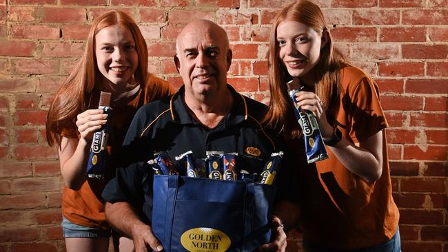 Twins Tamika and Jasmine Covrney with Golden North marketing and exports director Trevor Pomery at the Nailsworth outlet. Picture: Keryn Stevens.