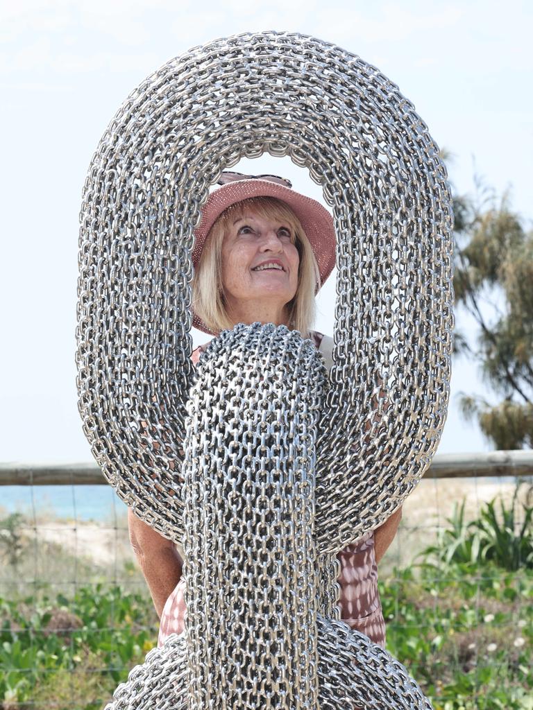 Swell Festival at Currumbin. Carol Newman from Gilston. looks at Synergy by Michael Van Dam. Picture Glenn Hampson