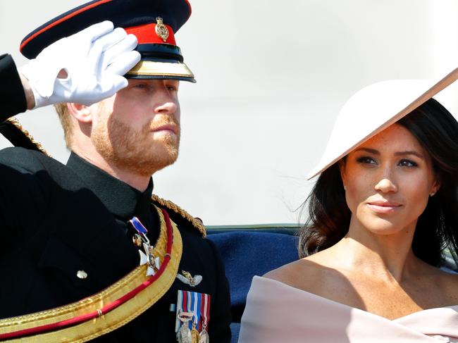 LONDON, UNITED KINGDOM - JUNE 09: (EMBARGOED FOR PUBLICATION IN UK NEWSPAPERS UNTIL 24 HOURS AFTER CREATE DATE AND TIME) Prince Harry, Duke of Sussex and Meghan, Duchess of Sussex travel down The Mall in a horse drawn carriage during Trooping The Colour 2018 on June 9, 2018 in London, England. The annual ceremony involving over 1400 guardsmen and cavalry, is believed to have first been performed during the reign of King Charles II. The parade marks the official birthday of the Sovereign, even though the Queen's actual birthday is on April 21st. (Photo by Max Mumby/Indigo/Getty Images)