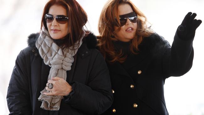 Priscilla Presley and daughter Lisa Marie Presley take care of business for the late Elvis. Picture: Supplied.