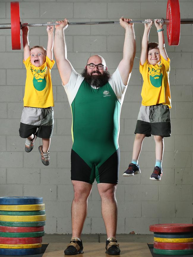 Weightlifter Damon Kelly with his sons Tom, 3, and Paddy Kelly, 5, has had to quit as he finds it too hard to train and work with a young family. Picture: Liam Kidston